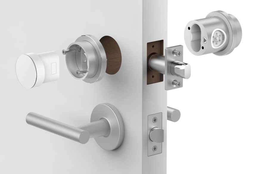 Exploded render of the Otto lock: interior and exterior units, deadbolt and strike on a door